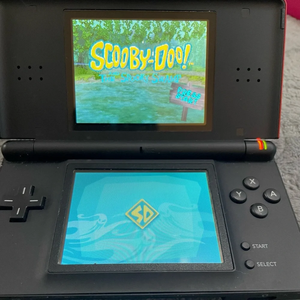 Nintendo DS Lite- excellent condition - comes with 13 games +